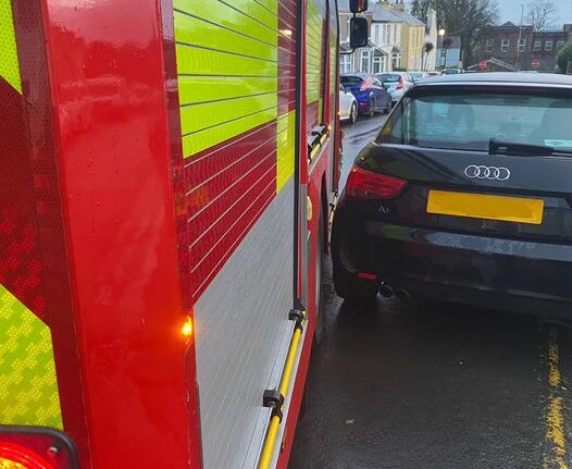 Fire pump stuck passing a parked vehicle.