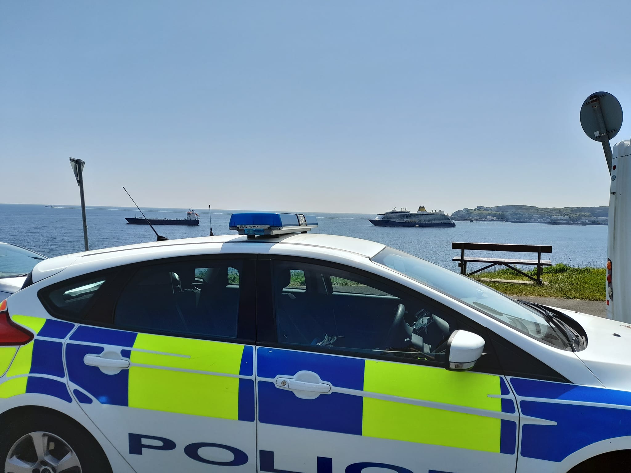 Police vehicle with view of seafront.