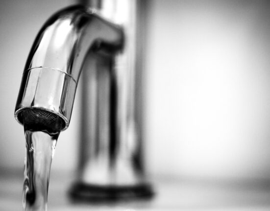 Water coming out of tap.
