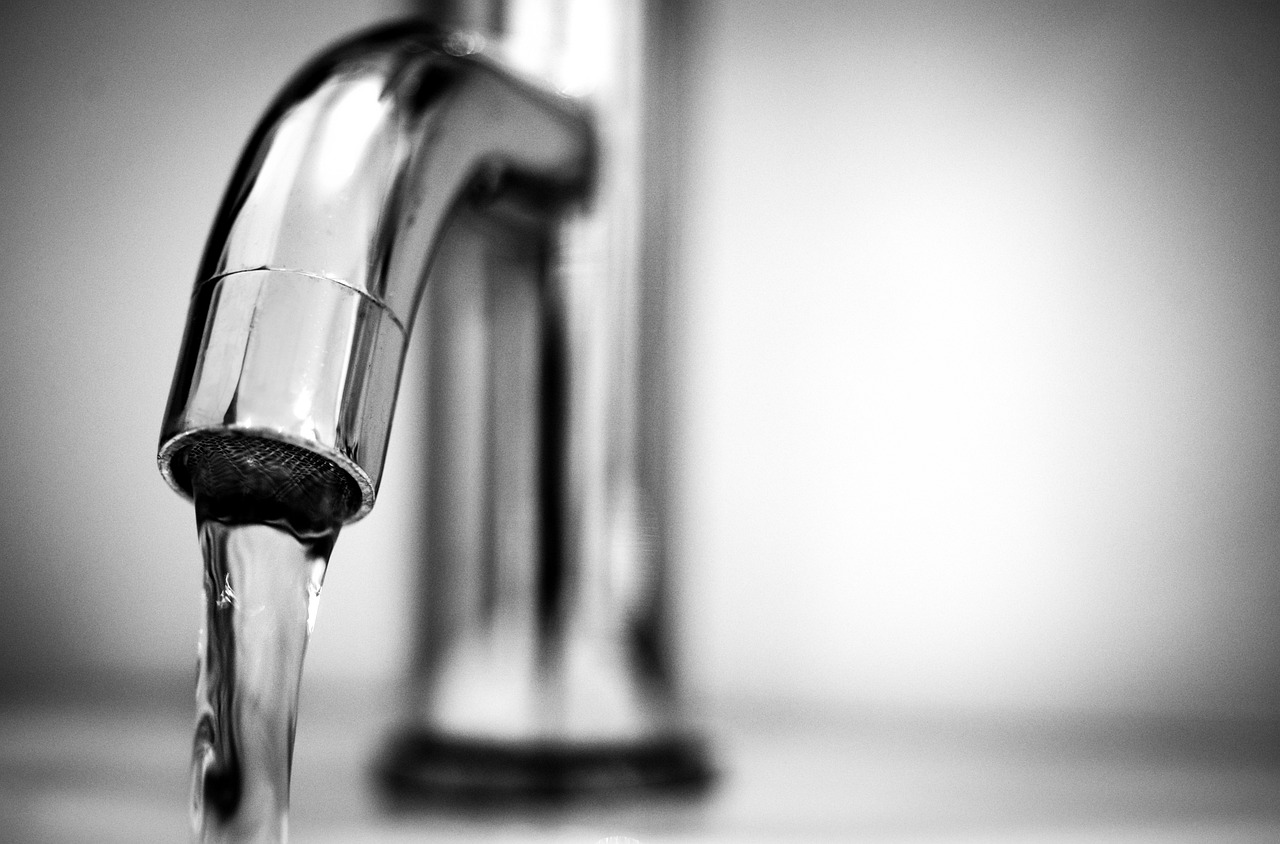 Water coming out of tap.