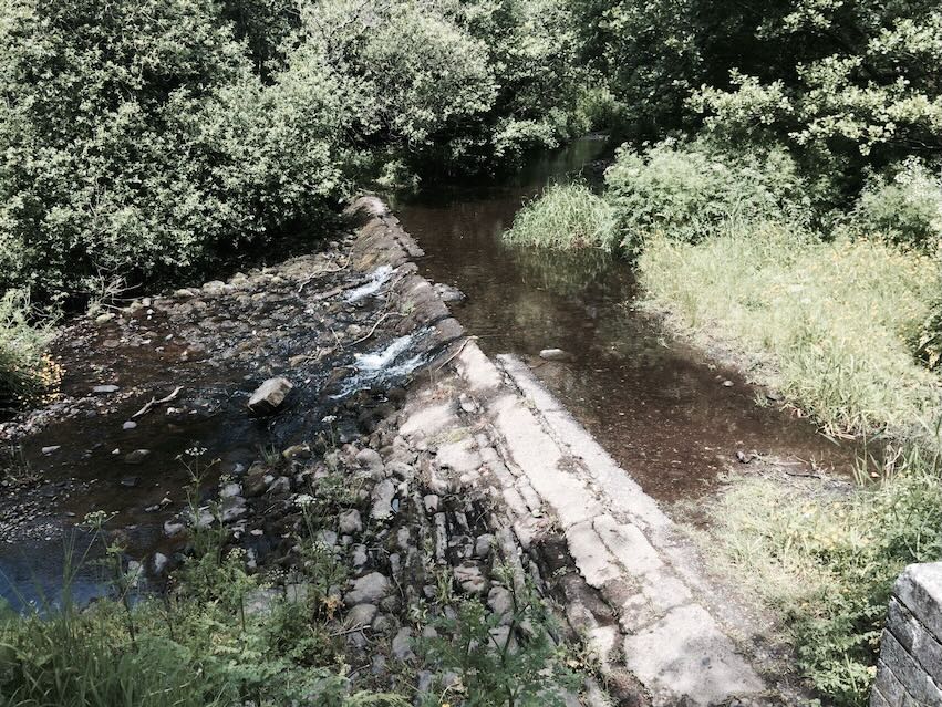 The River Glass Weir which feeds the former laundry dam.